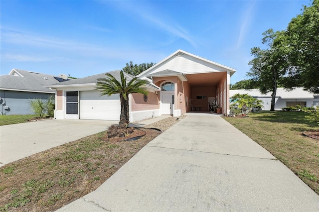 1752 Challenger Ave, Davenport, FL 33897 - view of front facade featuring driveway, a front yard, stucco siding, and a garage