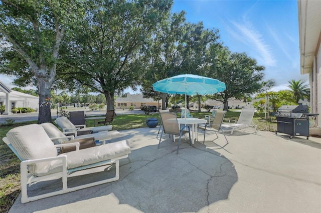 1752 Challenger Ave, Davenport, FL 33897 - view of patio / terrace featuring a grill and outdoor dining area