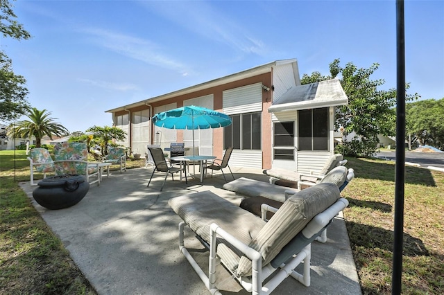 1752 Challenger Ave, Davenport, FL 33897 - view of patio with a sunroom and outdoor dining space