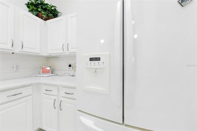 1752 Challenger Ave, Davenport, FL 33897 - kitchen featuring white cabinets and light countertops