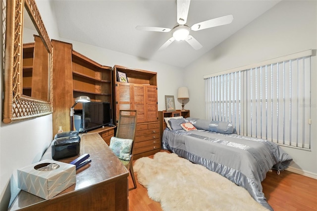 1752 Challenger Ave, Davenport, FL 33897 - bedroom with wood finished floors, lofted ceiling, and ceiling fan