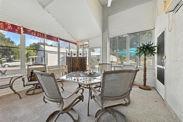 1752 Challenger Ave, Davenport, FL 33897 - sunroom with vaulted ceiling, outdoor dining space, and carpet flooring