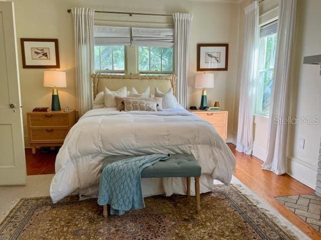 501 Richmond St, Orlando, FL 32806 - bedroom with multiple windows and wood finished floors