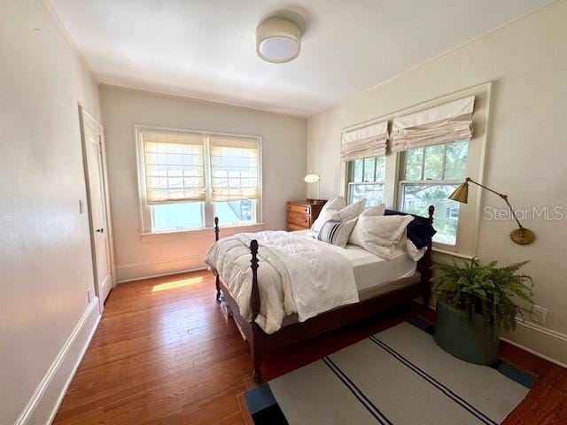 501 Richmond St, Orlando, FL 32806 - bedroom featuring wood finished floors and baseboards