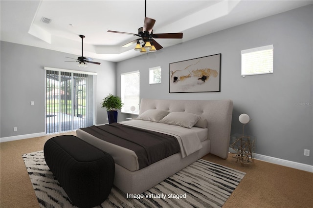 1441 Foxtail Ct, Lake Mary, FL 32746 - bedroom with a tray ceiling, carpet flooring, and multiple windows