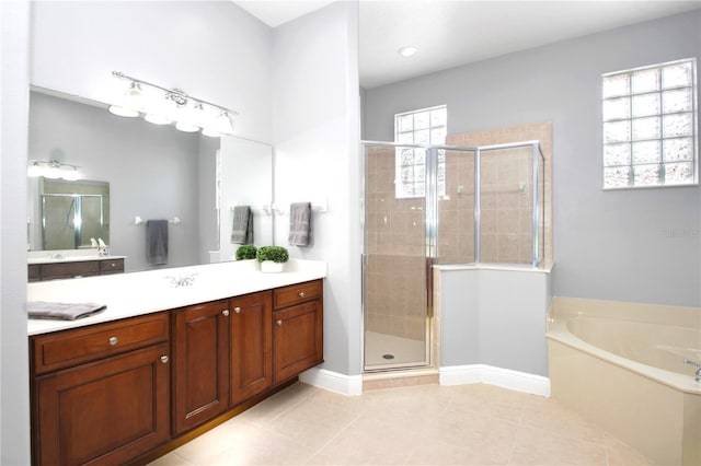 1441 Foxtail Ct, Lake Mary, FL 32746 - bathroom featuring vanity, a shower stall, a garden tub, and tile patterned flooring