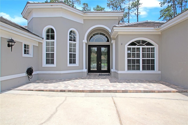 1441 Foxtail Ct, Lake Mary, FL 32746 - doorway to property with french doors and stucco siding