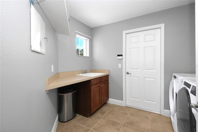1441 Foxtail Ct, Lake Mary, FL 32746 - laundry area featuring washer and dryer, light tile patterned floors, and cabinet space