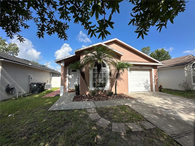 1470 Daniels Cove Dr, Winter Garden, FL 34787 - ranch-style house featuring an attached garage, concrete driveway, stucco siding, and a front yard