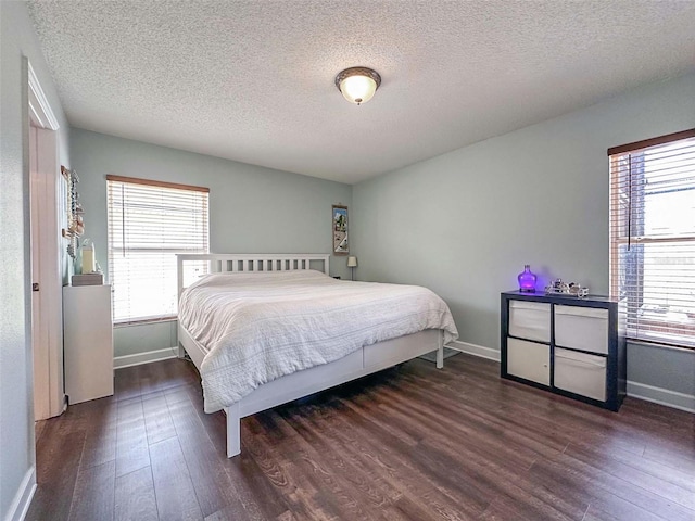 1470 Daniels Cove Dr, Winter Garden, FL 34787 - bedroom with dark wood finished floors and a textured ceiling