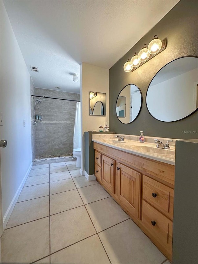 1470 Daniels Cove Dr, Winter Garden, FL 34787 - full bathroom featuring double vanity, tiled shower, tile patterned flooring, and a textured ceiling