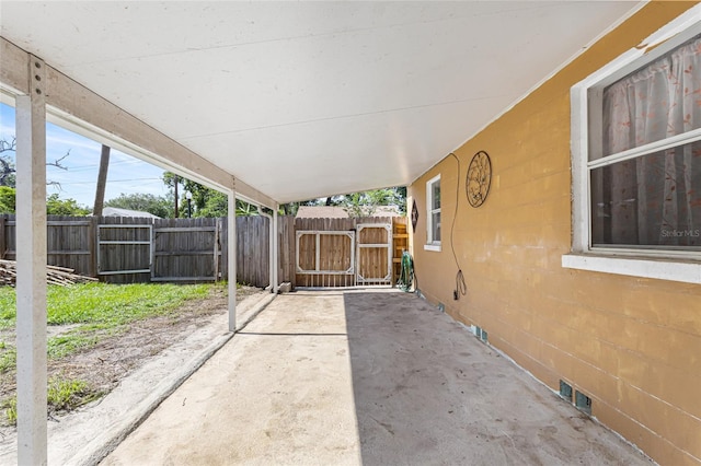 1104 W Marjorie St, Lakeland, FL 33815 - view of patio / terrace featuring a gate and a carport