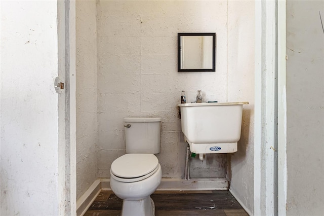 1104 W Marjorie St, Lakeland, FL 33815 - bathroom with toilet and wood finished floors