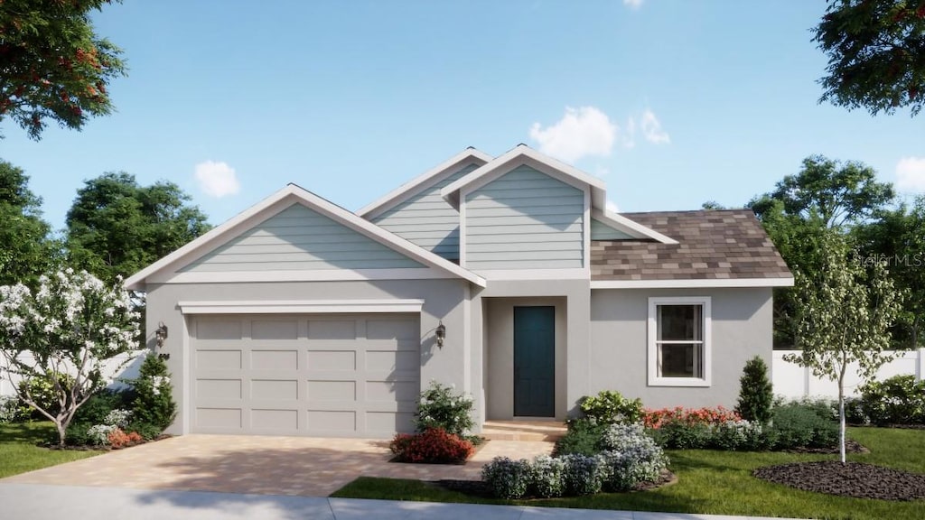 1816 Columbus Path, Saint Cloud, FL 34771 - view of front of property with an attached garage, driveway, stucco siding, and a shingled roof