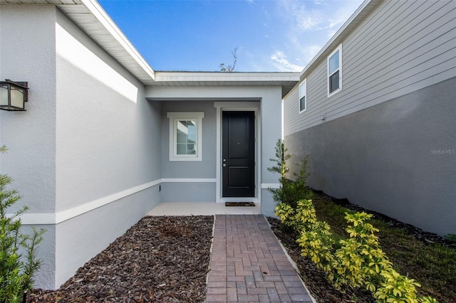 5029 Grand Teton Ct, Deland, FL 32724 - property entrance with stucco siding