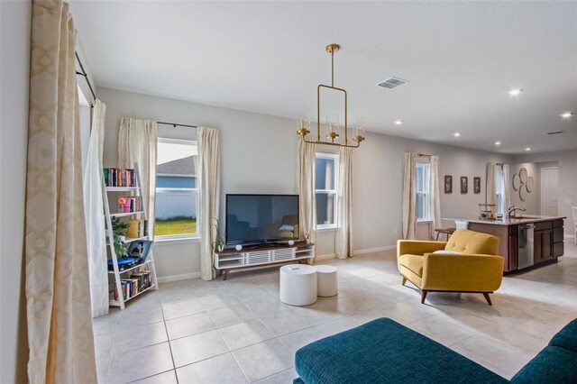 5029 Grand Teton Ct, Deland, FL 32724 - living room with light tile patterned floors and recessed lighting