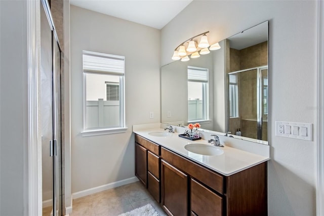 5029 Grand Teton Ct, Deland, FL 32724 - bathroom with double vanity, a shower stall, plenty of natural light, and tile patterned floors