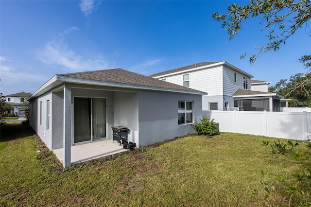 5029 Grand Teton Ct, Deland, FL 32724 - back of property featuring stucco siding, a patio area, and roof with shingles