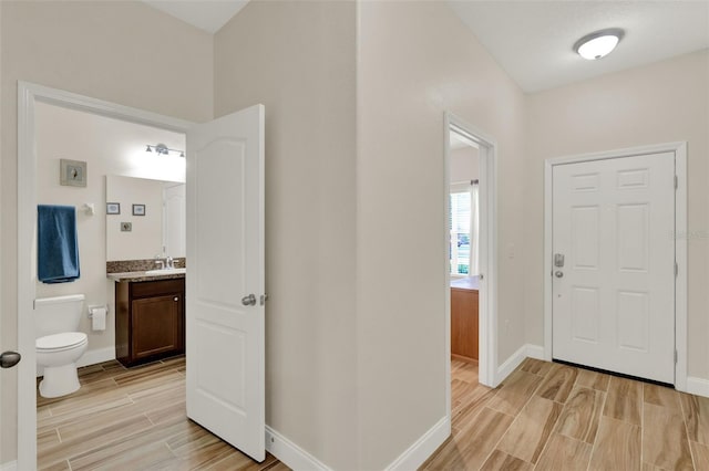 3210 Sonesta Ct Unit B, Clermont, FL 34711 - entrance foyer featuring wood tiled floors and baseboards