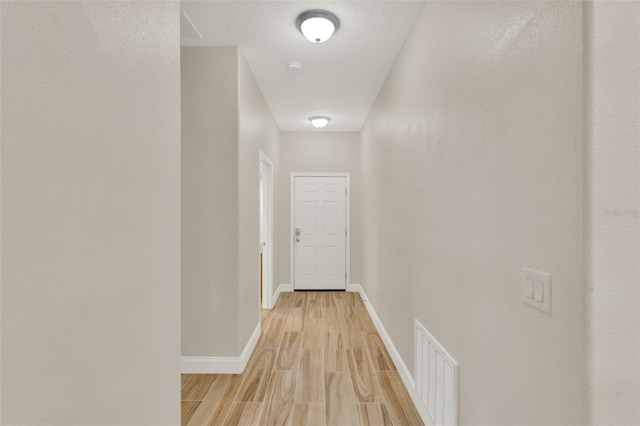 3210 Sonesta Ct Unit B, Clermont, FL 34711 - corridor with baseboards and light wood-type flooring