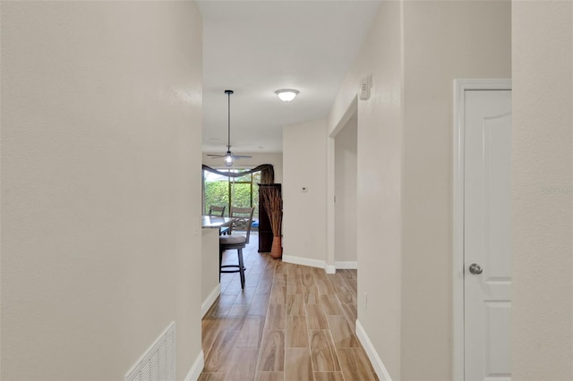 3210 Sonesta Ct Unit B, Clermont, FL 34711 - hall featuring baseboards and light wood-style flooring