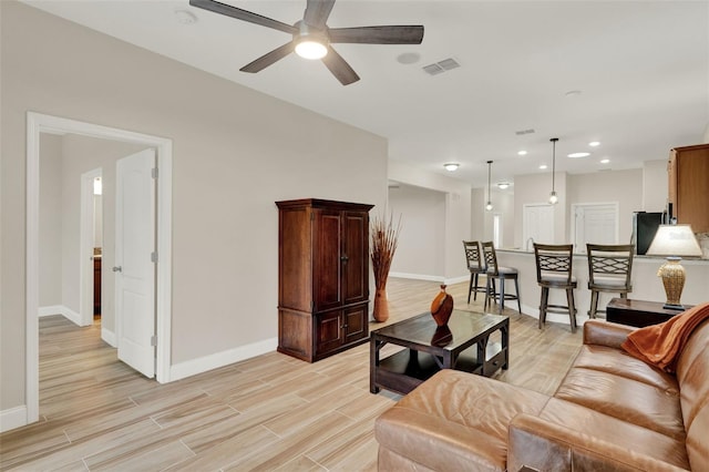 3210 Sonesta Ct Unit B, Clermont, FL 34711 - living room with light wood-style floors, a ceiling fan, and recessed lighting
