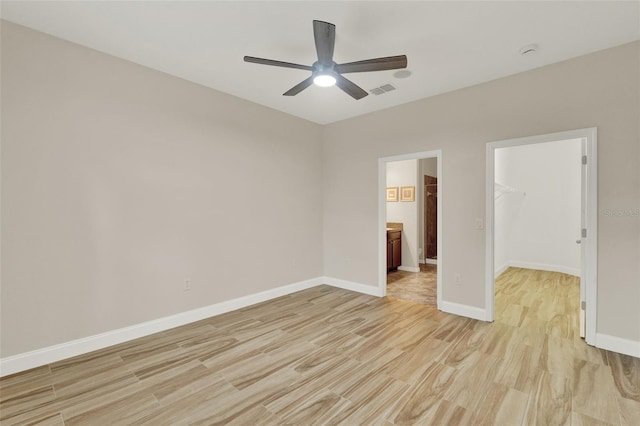 3210 Sonesta Ct Unit B, Clermont, FL 34711 - spare room featuring light wood-style flooring, ceiling fan, and a smoke detector