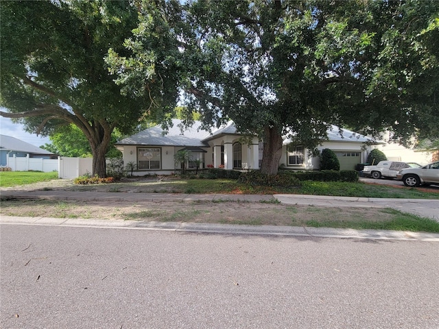8603 Snowfire Dr, Orlando, FL 32818 - view of front facade featuring a garage