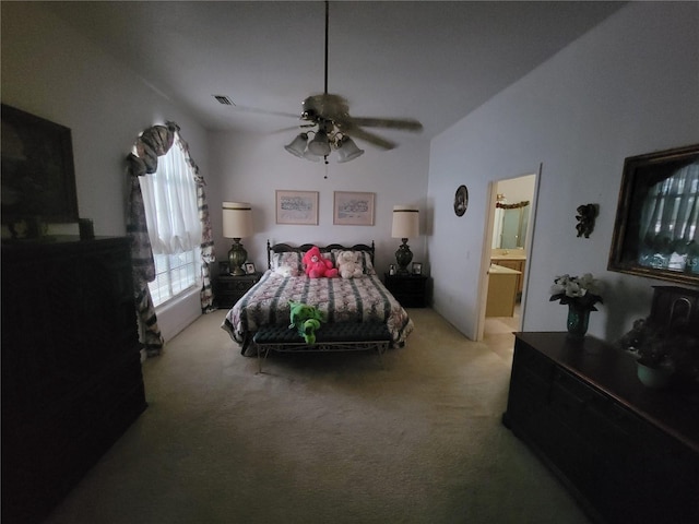 8603 Snowfire Dr, Orlando, FL 32818 - bedroom with light carpet, ceiling fan, and ensuite bath