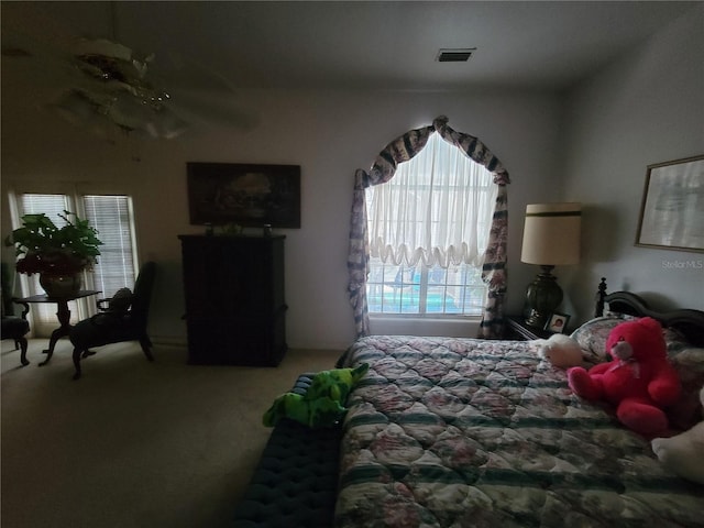 8603 Snowfire Dr, Orlando, FL 32818 - bedroom with carpet flooring and a ceiling fan