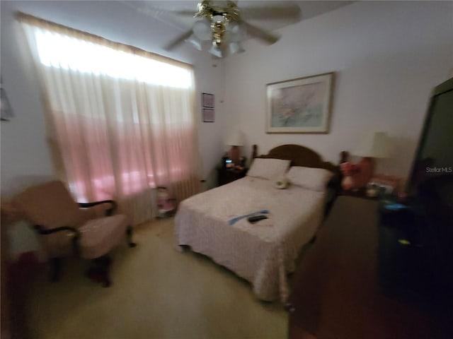 8603 Snowfire Dr, Orlando, FL 32818 - bedroom featuring light colored carpet and a ceiling fan