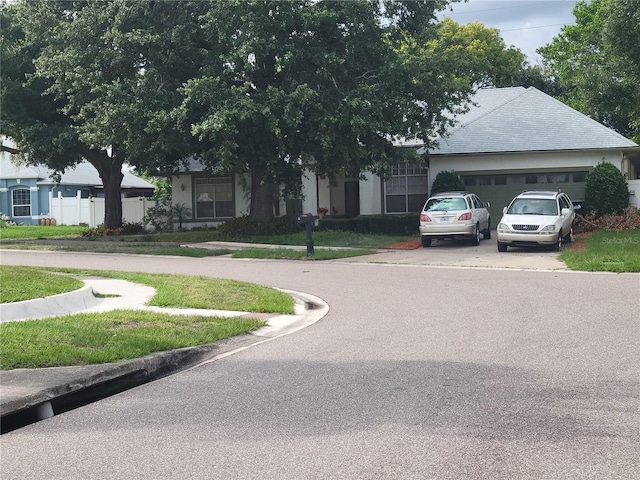 8603 Snowfire Dr, Orlando, FL 32818 - view of asphalt street featuring curbs