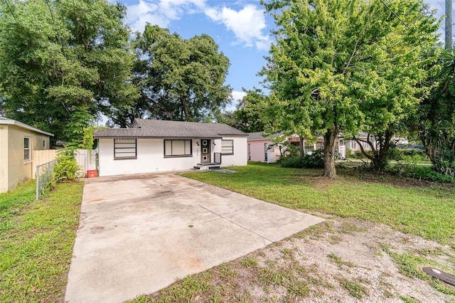 1422 Russell Ave, Orlando, FL 32806 - single story home with concrete driveway and stucco siding