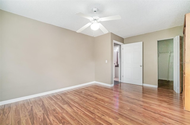 1422 Russell Ave, Orlando, FL 32806 - unfurnished bedroom with light wood-style floors and ceiling fan