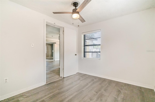 1422 Russell Ave, Orlando, FL 32806 - empty room with wood finished floors and a ceiling fan