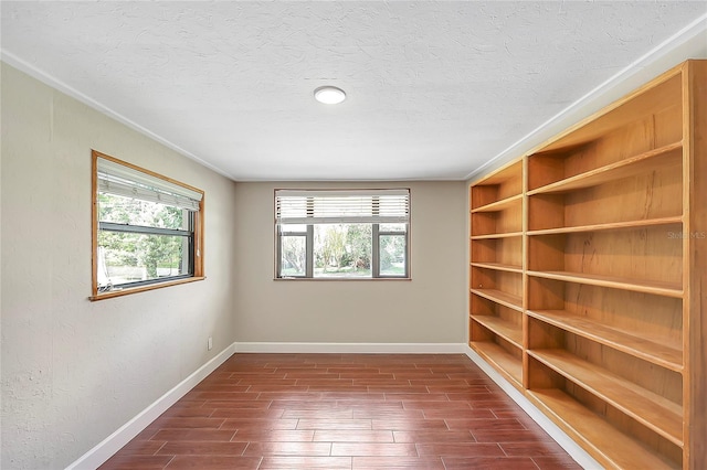 1204 Marie Ave, Apopka, FL 32703 - unfurnished room featuring healthy amount of natural light, wood finish floors, a textured ceiling, and crown molding