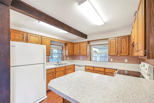 1204 Marie Ave, Apopka, FL 32703 - kitchen featuring white appliances, light countertops, plenty of natural light, and beamed ceiling