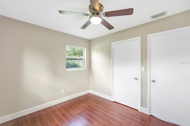 1204 Marie Ave, Apopka, FL 32703 - unfurnished bedroom with dark wood-type flooring and a ceiling fan