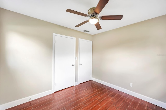 1204 Marie Ave, Apopka, FL 32703 - empty room featuring dark wood-type flooring and a ceiling fan