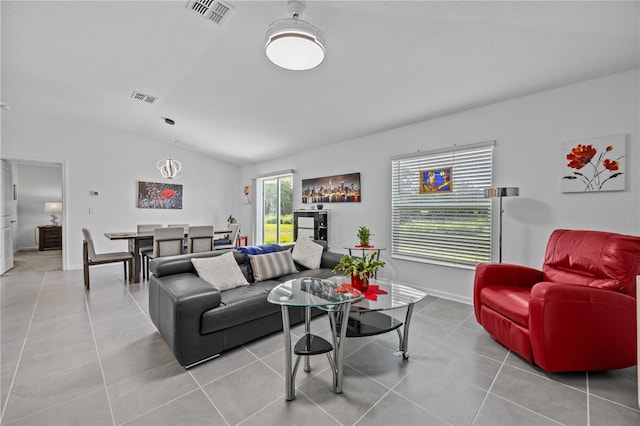 873 Daring Dr, Davenport, FL 33837 - living area featuring vaulted ceiling and light tile patterned floors