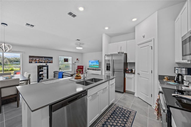 873 Daring Dr, Davenport, FL 33837 - kitchen featuring stainless steel appliances, open floor plan, white cabinetry, and recessed lighting