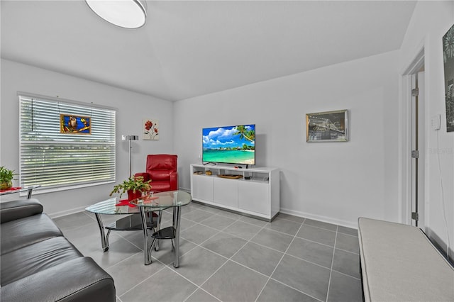 873 Daring Dr, Davenport, FL 33837 - tiled living area with baseboards and lofted ceiling