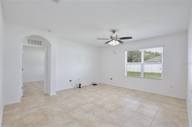 1565 Diamond Loop Dr, Kissimmee, FL 34744 - spare room featuring arched walkways and ceiling fan