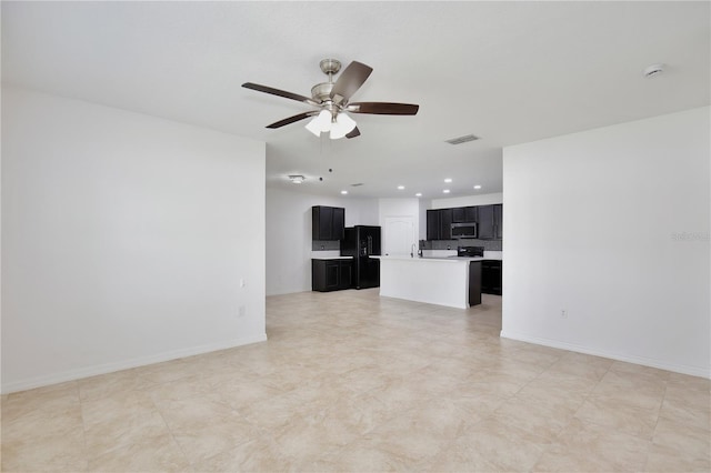 1565 Diamond Loop Dr, Kissimmee, FL 34744 - unfurnished living room with a ceiling fan and recessed lighting