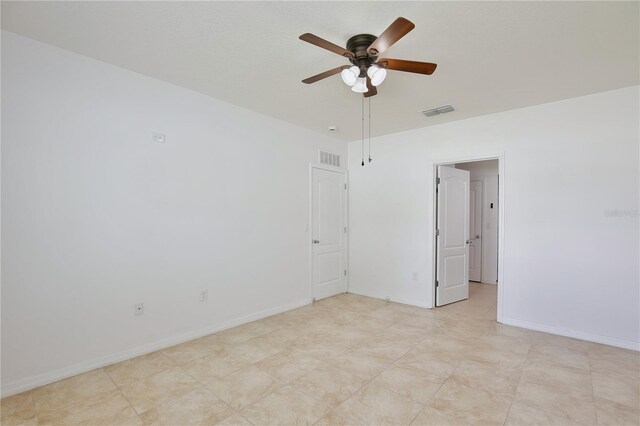 1565 Diamond Loop Dr, Kissimmee, FL 34744 - unfurnished room with a ceiling fan and baseboards