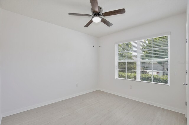 1565 Diamond Loop Dr, Kissimmee, FL 34744 - empty room featuring light wood finished floors and ceiling fan