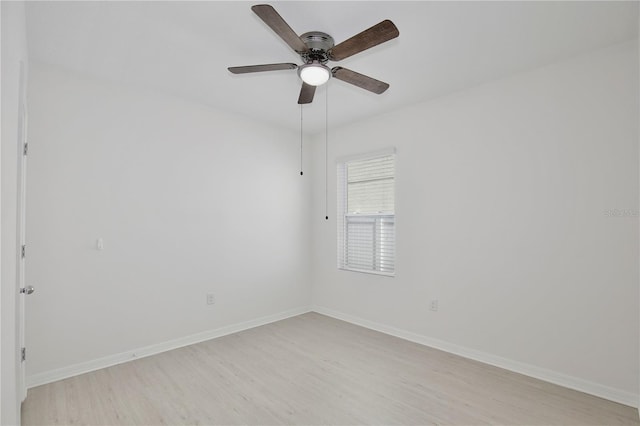 1565 Diamond Loop Dr, Kissimmee, FL 34744 - empty room featuring light wood-style floors and ceiling fan