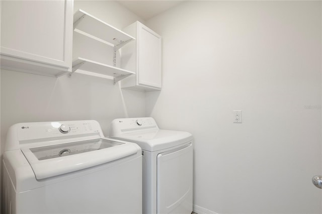 1565 Diamond Loop Dr, Kissimmee, FL 34744 - laundry area with washer and clothes dryer and cabinet space