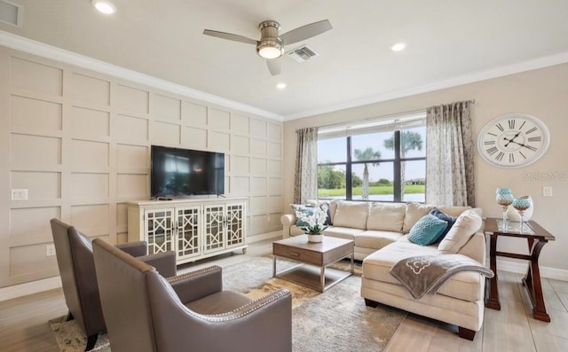 13084 Rinella St, Venice, FL 34293 - living room with crown molding, a ceiling fan, recessed lighting, and a decorative wall