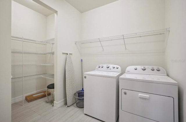13084 Rinella St, Venice, FL 34293 - washroom with washer and dryer and baseboards